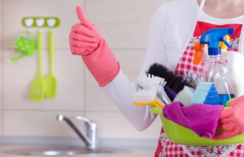 Technician applying cleaning product with care and protective measures